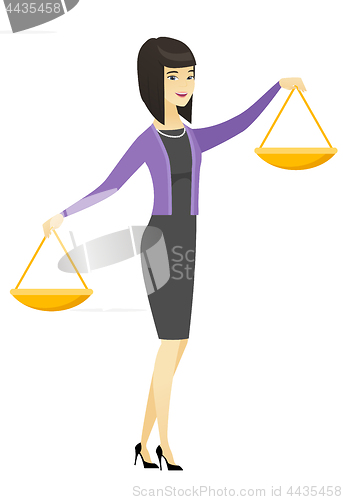 Image of Asian business woman holding balance scale.