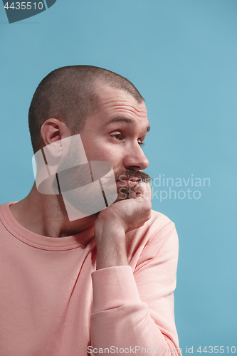 Image of Beautiful bored man bored isolated on blue background