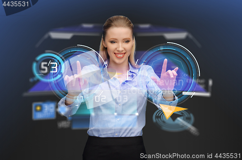 Image of businesswoman with navigator on virtual screen