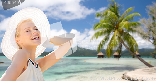 Image of beautiful woman enjoying summer over beach