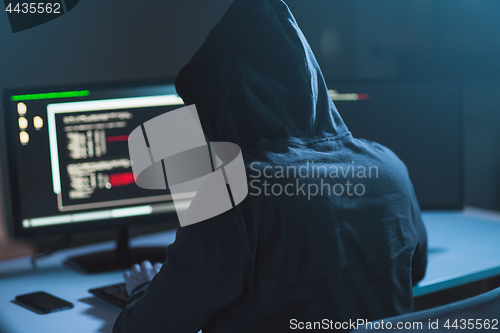 Image of hacker using computer virus for cyber attack