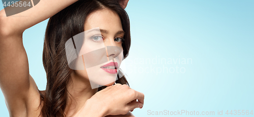 Image of beautiful young woman with red lipstick