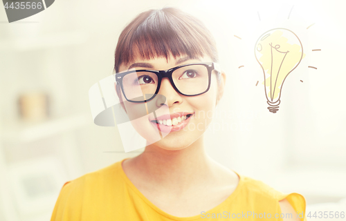 Image of asian woman in glasses with light bulb doodle