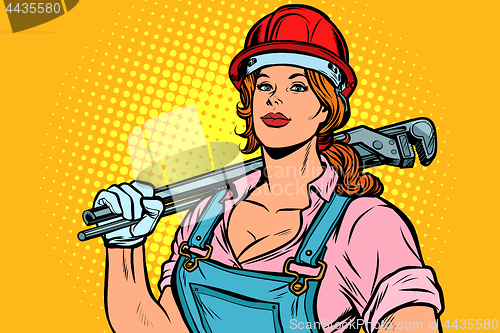 Image of Pop art woman plumber mechanic with wrench