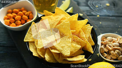 Image of Plate of corn chips with nuts