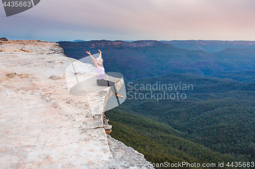 Image of Sitting on the cliff edge feeling free