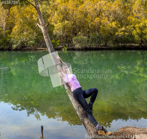 Image of Female relaxes in a bushland Bliss
