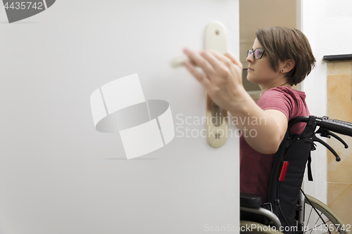 Image of disabled woman at the open door with space for your content