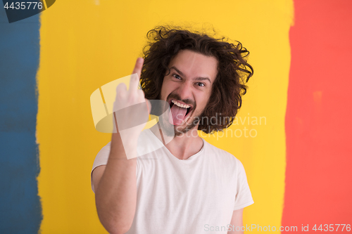 Image of young man with funny hair over color background