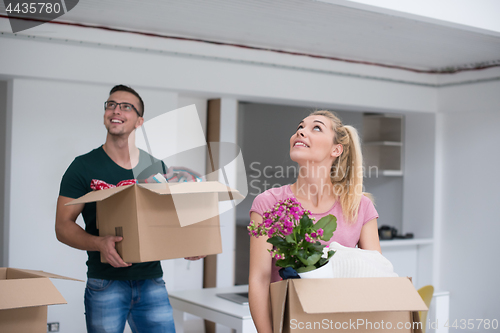 Image of young couple moving into a new home