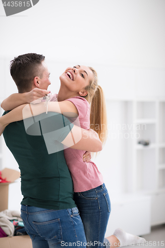 Image of happy Young couple moving in new house