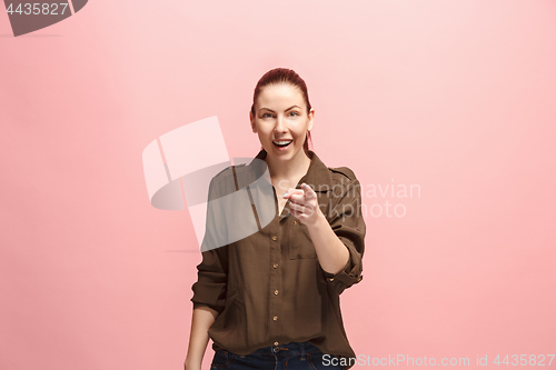 Image of The happy business woman point you and want you, half length closeup portrait on pink background.