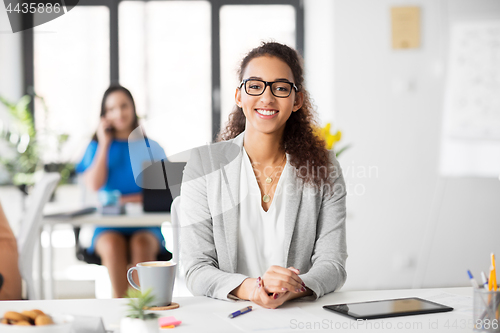 Image of happy smiling african american woman at office