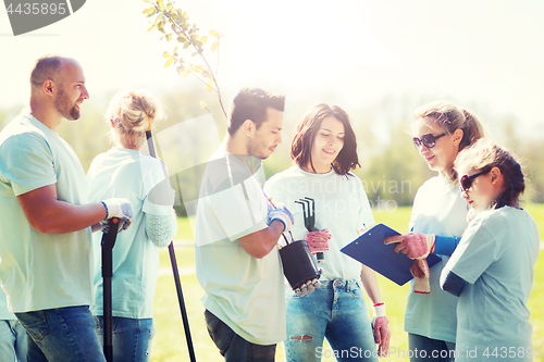 Image of group of volunteers planting trees in park