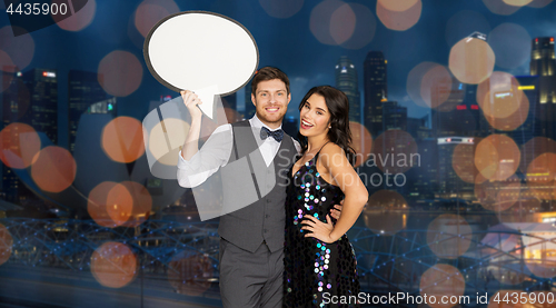 Image of happy couple at party holding text bubble banner