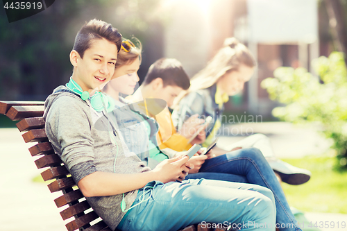 Image of happy teenage boy with tablet pc and headphones