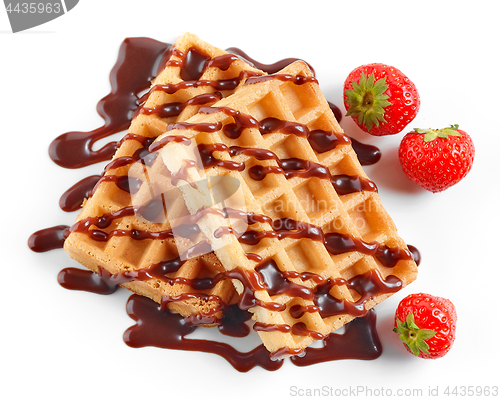 Image of two waffles decorated with chocolat sauce and strawberries