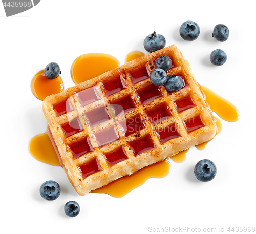 Image of waffle with caramel syrup and blueberries