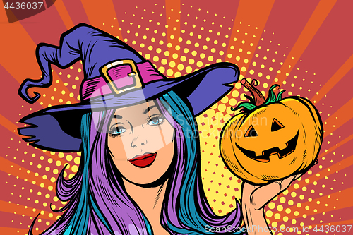 Image of happy Halloween witch with pumpkin