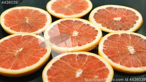 Image of Slices of grapefruit on table 