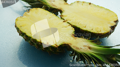 Image of Bright halves of yellow pineapples