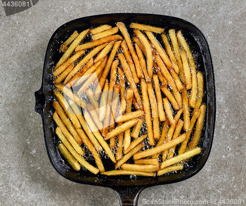 Image of fried potatoes in frying pan