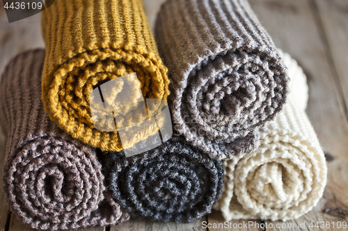 Image of Five knitted wooden scarves