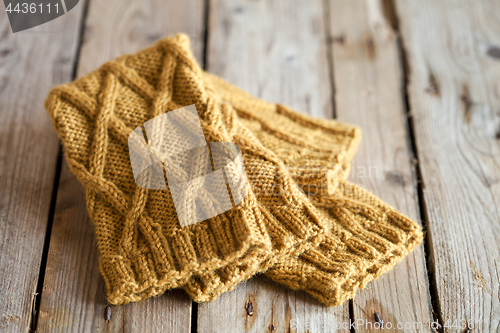 Image of knitted yellow leg warmers