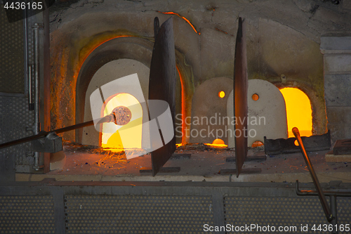 Image of Manufacturing glass in a traditional oven, in glass factory in M