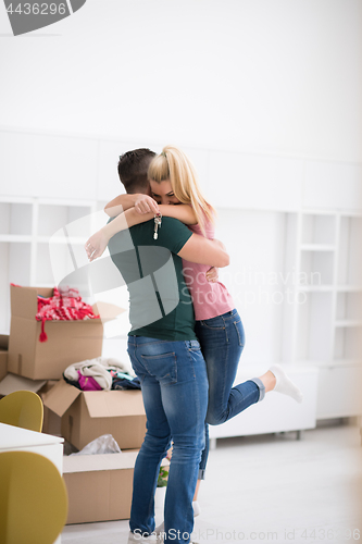 Image of happy Young couple moving in new house