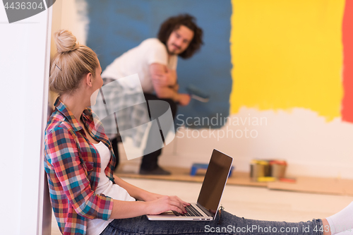 Image of Happy couple doing home renovations