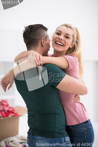 Image of happy Young couple moving in new house