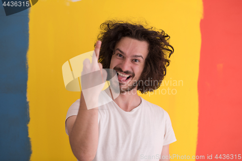 Image of young man with funny hair over color background