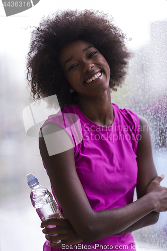 Image of portrait of young afro american woman in gym