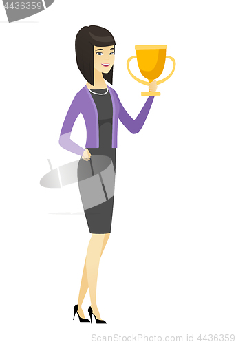 Image of Asian business woman holding a trophy.