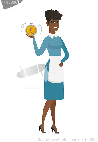Image of African cleaner holding alarm clock.
