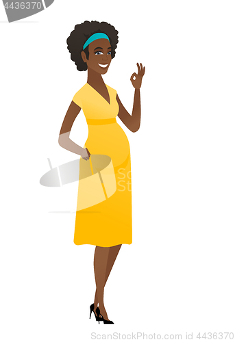 Image of Smiling pregnant woman showing ok sign.