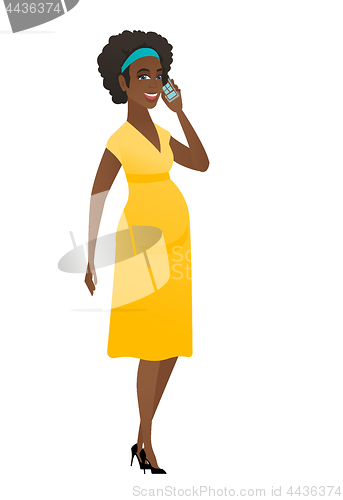 Image of Pregnant woman talking on a mobile phone.