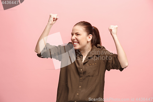 Image of Winning success woman happy ecstatic celebrating being a winner. Dynamic energetic image of female model