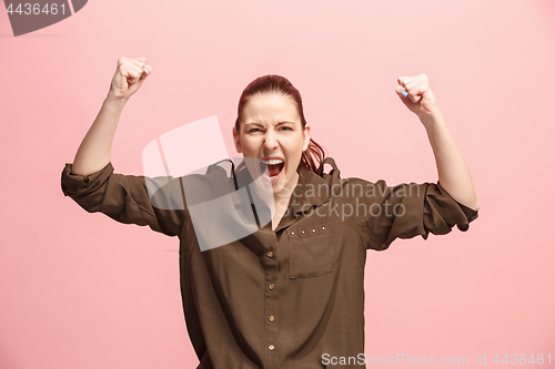 Image of Winning success woman happy ecstatic celebrating being a winner. Dynamic energetic image of female model