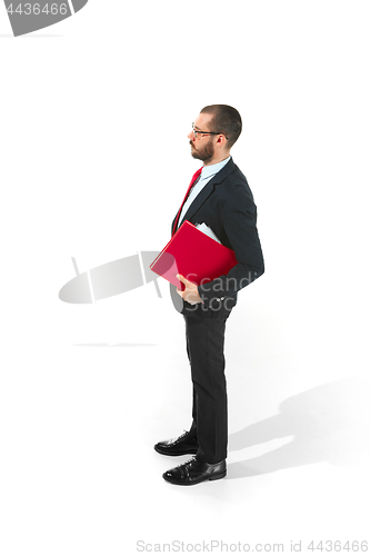 Image of Full body portrait of businessman with folder on white