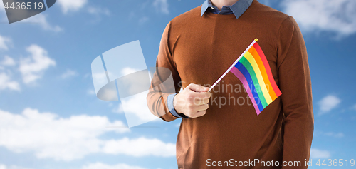 Image of close up of man with gay pride rainbow flag