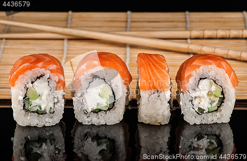 Image of Several Philadelphia Sushi roll in a row