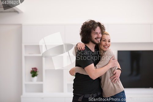 Image of couple hugging in their new home