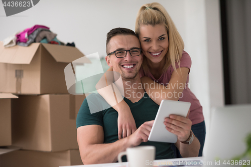 Image of Young couple moving in a new home