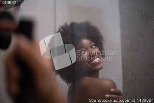 Image of African American woman in the shower