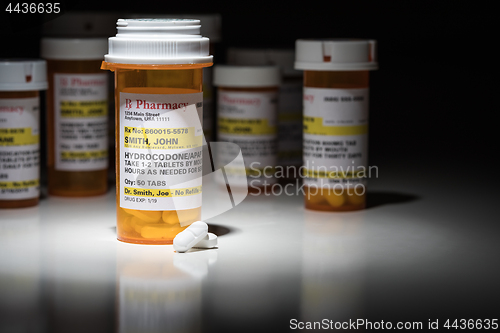 Image of Hydrocodone Pills and Prescription Bottles with Non Proprietary 