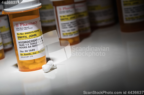 Image of Hydrocodone Pills and Prescription Bottles with Non Proprietary 