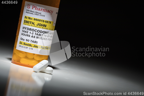 Image of Hydrocodone Pills and Prescription Bottle with Non Proprietary L