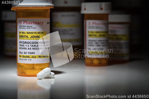 Image of Hydrocodone Pills and Prescription Bottles with Non Proprietary 